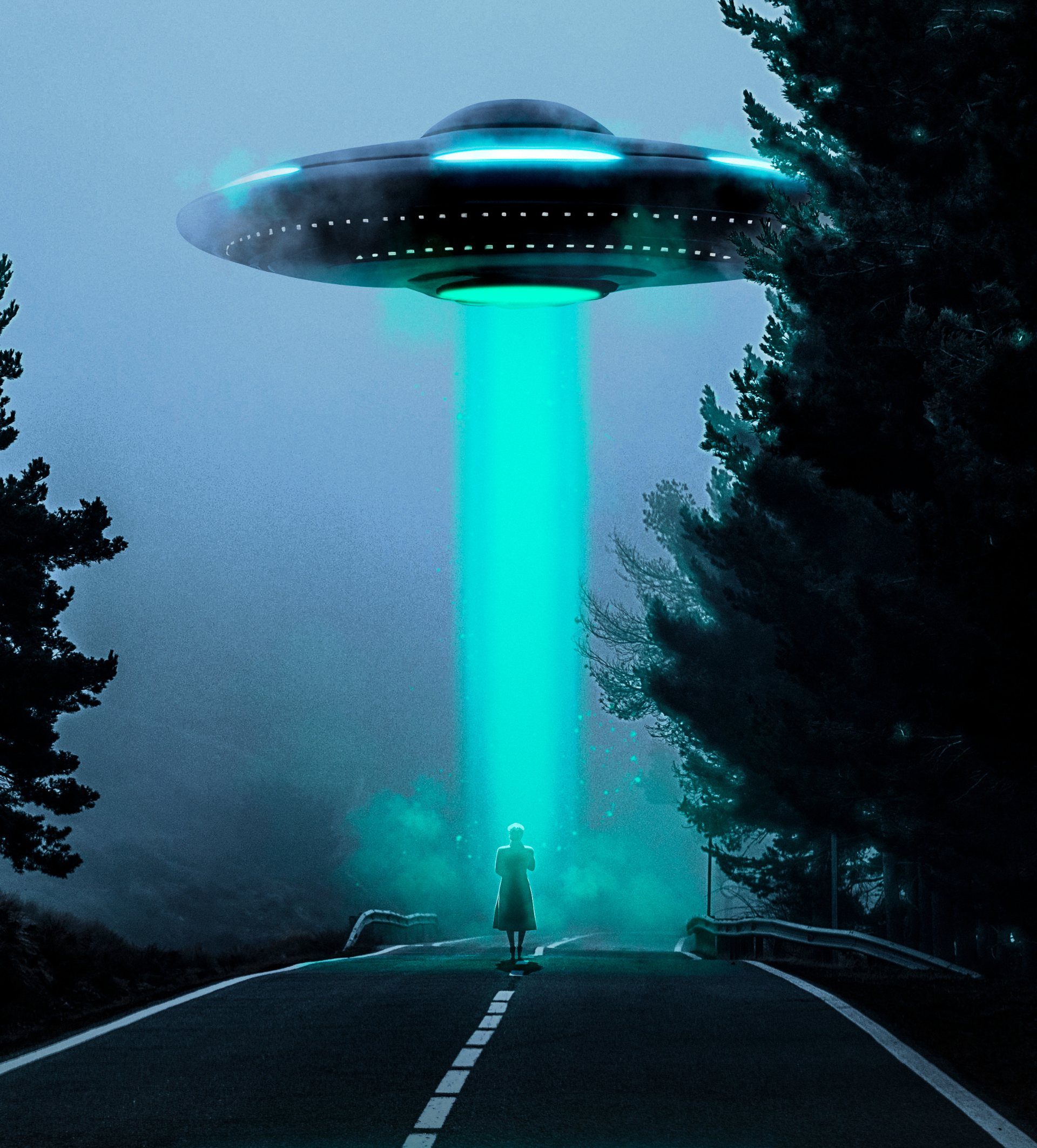 A lone figure standing on a dark road beneath a UFO projecting a beam of light